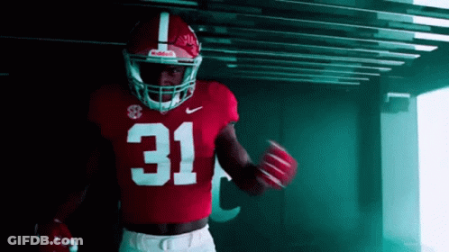 A Football Player Wearing A Red Jersey With The Number 31 GIF