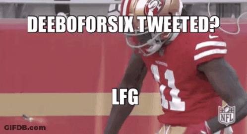 A Football Player Wearing A Red Jersey With The Number 33 On It GIF