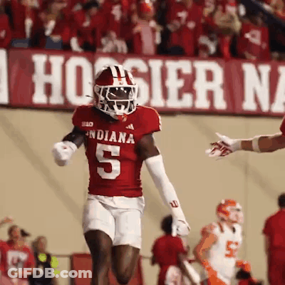 A Football Player Wearing A Red Jersey With The Number 5 GIF