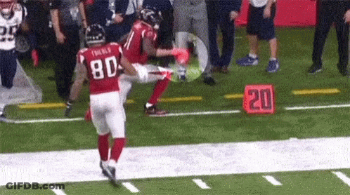 A Football Player Wearing A Red Jersey With The Number 80 On It GIF
