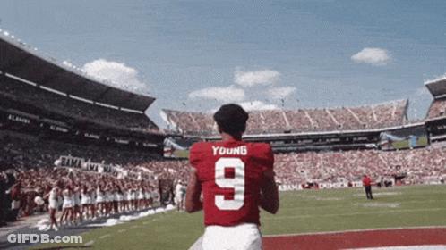 A Football Player Wearing A Red Jersey With The Number 9 GIF