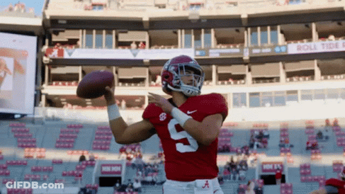 A Football Player Wearing A Red Jersey With The Number 9 On It GIF