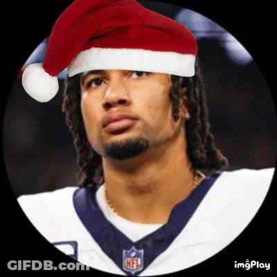 A Football Player Wearing A Santa Hat And A Nfl Jersey . GIF