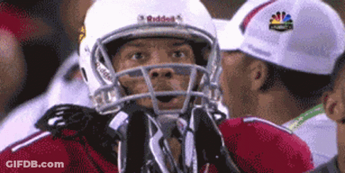A Football Player Wearing A White Helmet That Says Riddell On It GIF