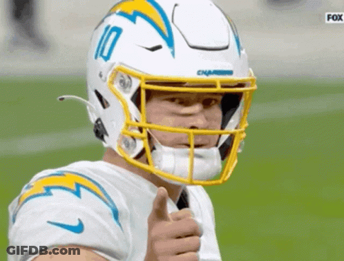 A Football Player Wearing A White Helmet With The Number 10 On It GIF