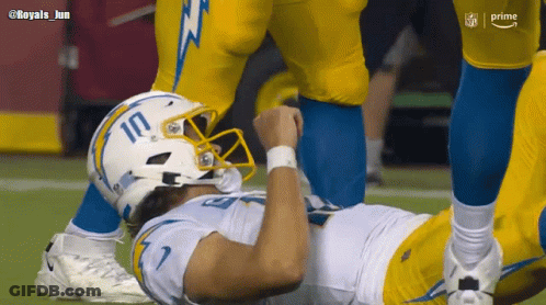 A Football Player Wearing A White Helmet With The Number 10 On It GIF