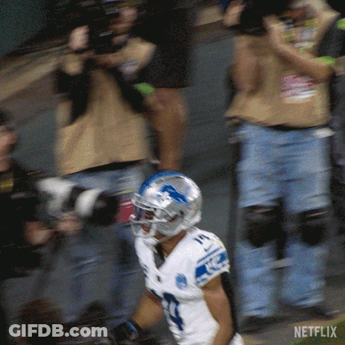 A Football Player Wearing A White Jersey With The Number 17 On It GIF