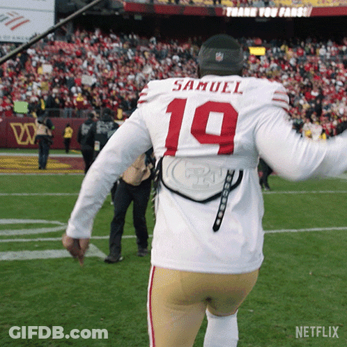 A Football Player Wearing A White Jersey With The Number 19 On The Back GIF