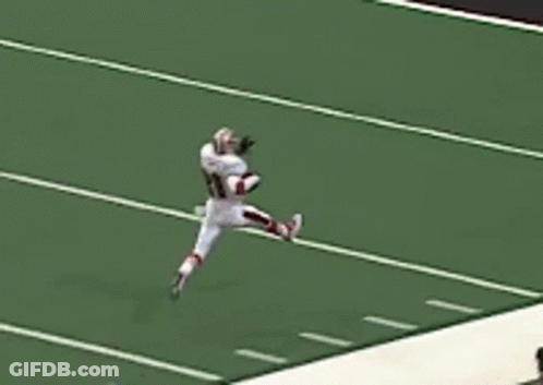 A Football Player Wearing A White Jersey With The Number 31 On It GIF