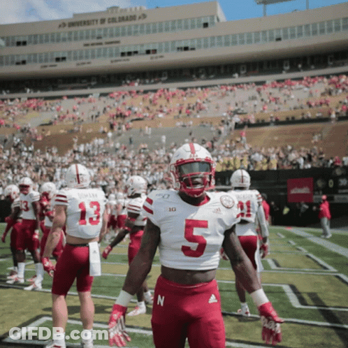A Football Player Wearing A White Jersey With The Number 5 On It GIF