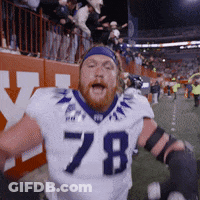 A Football Player Wearing A White Jersey With The Number 78 GIF