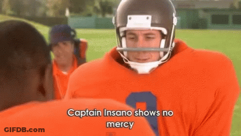 A Football Player Wearing An Orange Jersey With The Number 7 On It GIF