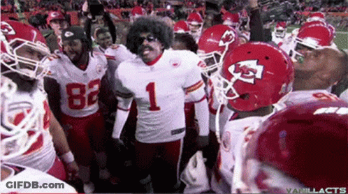 A Football Player Wearing Number 1 Is Surrounded By His Teammates GIF