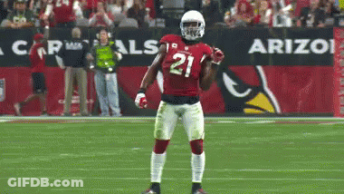 A Football Player Wearing Number 21 Stands On The Field GIF