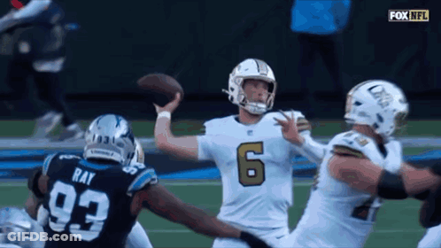 A Football Player Wearing Number 6 Throws The Ball GIF