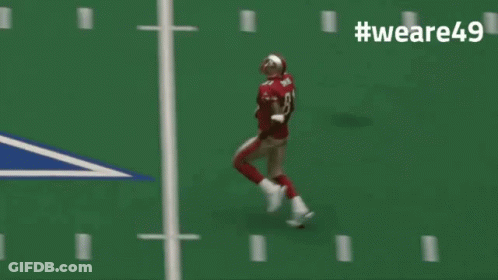 A Football Player Wearing Number 8 Is Running On A Field GIF