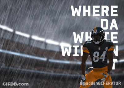 A Football Player Wearing Number 84 Is Standing In The Rain GIF
