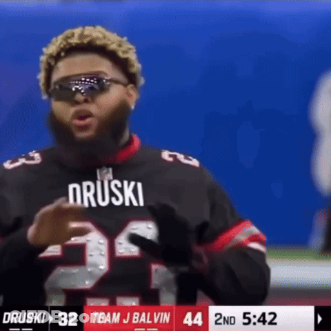 A Football Player Wearing Sunglasses And A Jersey That Says Druski GIF