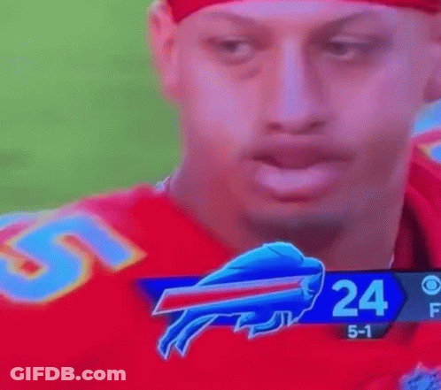 A Football Player With A Buffalo Bills Logo On His Face . GIF