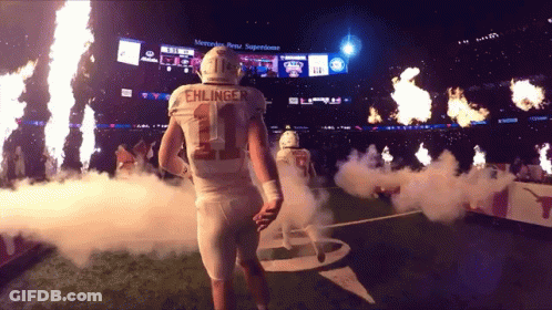A Football Player With The Name Ehlinger On His Back GIF