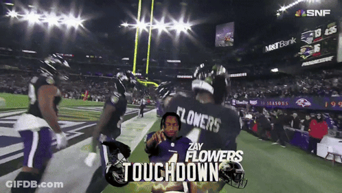 A Football Player With The Name Flowers On The Back Of His Shirt GIF