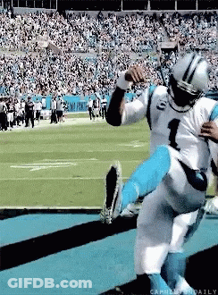 A Football Player With The Number 1 On His Jersey Is Being Lifted Up By Another Player GIF