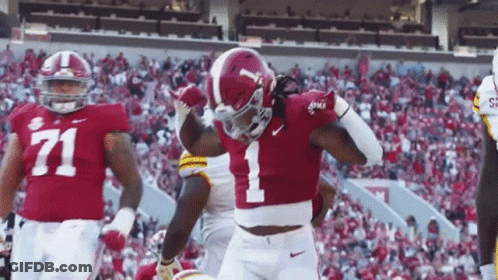 A Football Player With The Number 1 On His Jersey Is Celebrating GIF