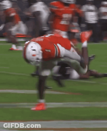 A Football Player With The Number 1 On His Jersey Is Doing A Handstand On The Field GIF