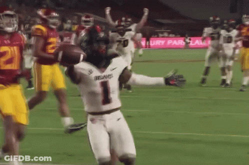 A Football Player With The Number 1 On His Jersey Is Running With A Ball GIF