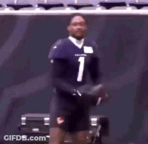 A Football Player With The Number 1 On His Jersey Is Standing In A Stadium GIF