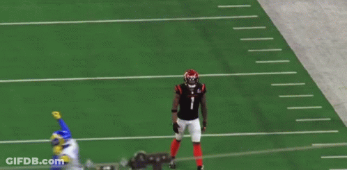 A Football Player With The Number 1 On His Jersey Is Walking On The Field GIF