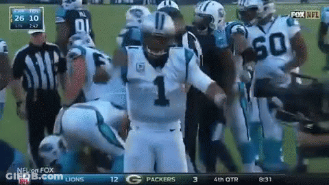 A Football Player With The Number 1 On His Jersey Stands In A Huddle With Other Players GIF