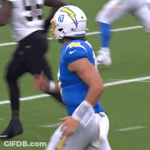 A Football Player With The Number 10 On His Helmet Runs On The Field GIF