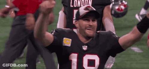 A Football Player With The Number 10 On His Jersey Is Celebrating GIF