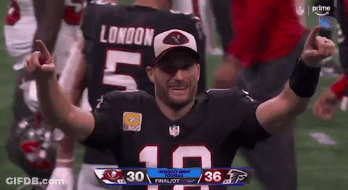 A Football Player With The Number 10 On His Jersey Is Celebrating GIF