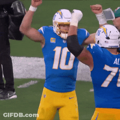 A Football Player With The Number 10 On His Jersey Is Celebrating With His Teammate GIF