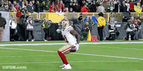 A Football Player With The Number 10 On His Jersey Is On The Field GIF