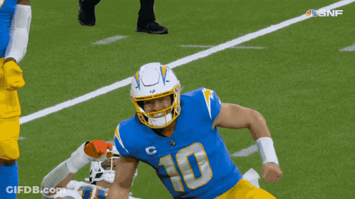 A Football Player With The Number 10 On His Jersey Is Running On The Field GIF