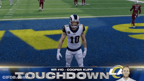 A Football Player With The Number 10 On His Jersey Is Standing On The Field GIF