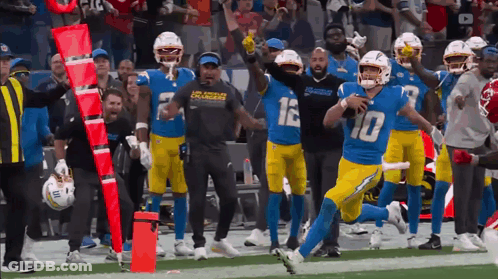 A Football Player With The Number 10 On His Jersey Runs On The Field GIF