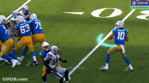 A Football Player With The Number 10 On His Jersey Throws A Pass GIF