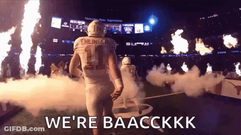 A Football Player With The Number 11 On His Jersey Is Walking Out Of The Stadium . GIF