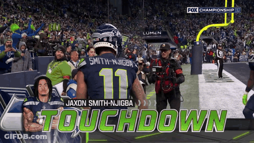 A Football Player With The Number 11 On His Jersey Stands On The Field GIF