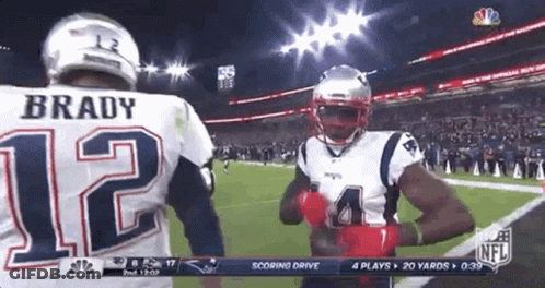A Football Player With The Number 12 On His Back GIF