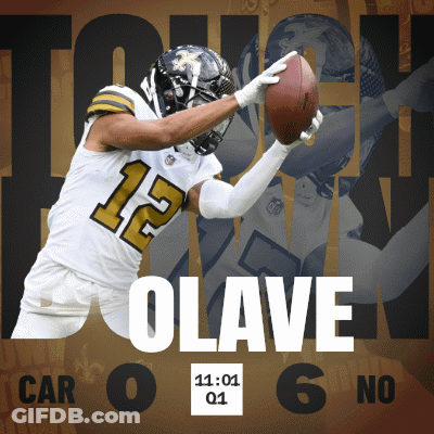 A Football Player With The Number 12 On His Jersey Catching A Ball GIF