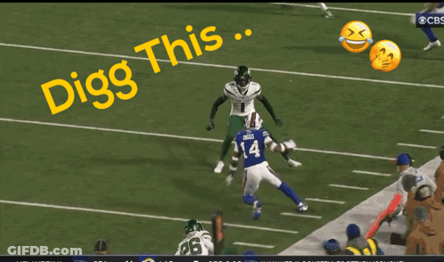 A Football Player With The Number 13 On His Jersey Is Being Tackled GIF
