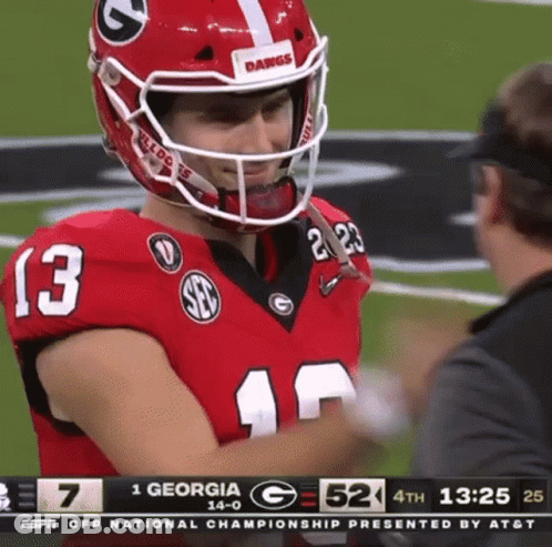 A Football Player With The Number 13 On His Jersey Is Talking To A Referee . GIF