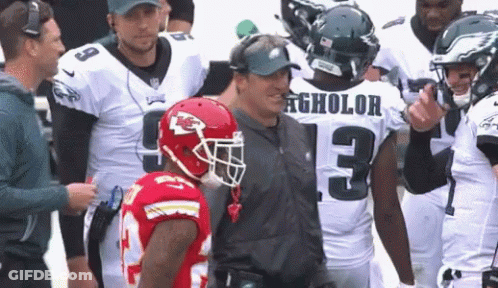 A Football Player With The Number 13 On His Jersey Talks To Another Player GIF