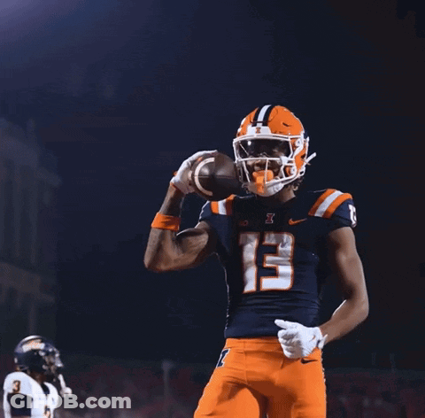 A Football Player With The Number 13 On His Jersey Throws A Football In The Air GIF