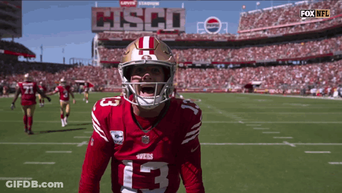 A Football Player With The Number 13 On His Shirt GIF